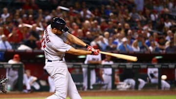 Apr 27, 2016; Phoenix, AZ, USA; St. Louis Cardinals pitcher Adam Wainwright hits a three run triple in the sixth inning against the Arizona Diamondbacks at Chase Field. Mandatory Credit: Mark J. Rebilas-USA TODAY Sports
