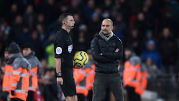 LIVERPOOL, ENGLAND - NOVEMBER 10: Pep Guardiola, Manager of Manchester City stares at referee Michael Oliver as he walks onto the pitch for the second halfduring the Premier League match between Liverpool FC and Manchester City at Anfield on November 10, 2019 in Liverpool, United Kingdom. (Photo by Laurence Griffiths/Getty Images)