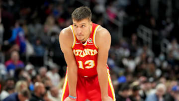 Denver Nuggets trade targets: Bogdan Bogdanovic #13 of the Atlanta Hawks looks on against the Detroit Pistons during the third quarter at Little Caesars Arena on 23 Mar. 2022 in Detroit, Michigan. (Photo by Nic Antaya/Getty Images)
