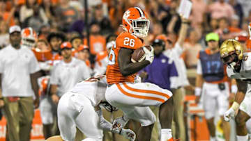 Clemson running back Phil Mafah (26) spins out of a tackle by Boston College linebacker Bryce Steele (2) runs during the second quarter at Memorial Stadium in Clemson, S.C., October 2, 2021.Ncaa Football Acc Clemson Boston College