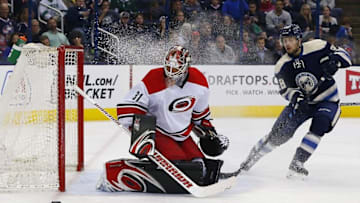 Mar 24, 2016; Columbus, OH, USA; Carolina Hurricanes goalie Eddie Lack (31) makes a save against Columbus Blue Jackets right wing Oliver Bjorkstrand (28) during the second period at Nationwide Arena. Mandatory Credit: Russell LaBounty-USA TODAY Sports