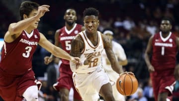 Dec 17, 2016; Houston, TX, USA; Texas Longhorns guard Kerwin Roach Jr. (12) dribbles the ball on a fast break as Arkansas Razorbacks guard Dusty Hannahs (3) defends during the first half at Toyota Center. Mandatory Credit: Troy Taormina-USA TODAY Sports