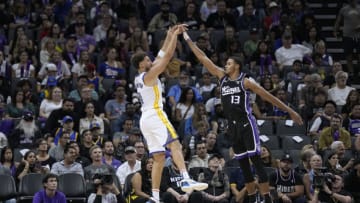 SACRAMENTO, CALIFORNIA - OCTOBER 15: Klay Thompson #11 of the Golden State Warriors shoots over Keegan Murray #13 of the Sacramento Kings during the first half of an NBA game at Golden 1 Center on October 15, 2023 in Sacramento, California. NOTE TO USER: User expressly acknowledges and agrees that, by downloading and or using this photograph, User is consenting to the terms and conditions of the Getty Images License Agreement. (Photo by Thearon W. Henderson/Getty Images)