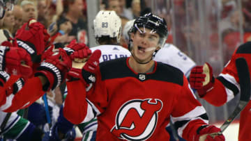 NEWARK, NEW JERSEY - OCTOBER 19: Jack Hughes #86 of the New Jersey Devils celebrates his first NHL goal against the Vancouver Canucks at the Prudential Center on October 19, 2019 in Newark, New Jersey. (Photo by Bruce Bennett/Getty Images)
