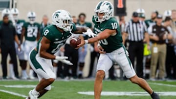 Michigan State quarterback Payton Thorne hands the ball to running back Jalen Berger against Western Michigan during the first half at Spartan Stadium in East Lansing on Friday, Sept. 2, 2022.