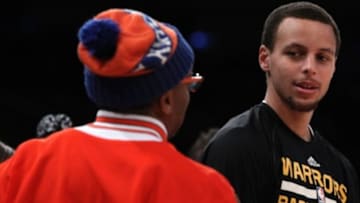 Feb 7, 2015; New York, NY, USA; Golden State Warriors guard Stephen Curry (30) talks to Spike Lee before the start of game against the New York Knicks at Madison Square Garden. Mandatory Credit: Noah K. Murray-USA TODAY Sports