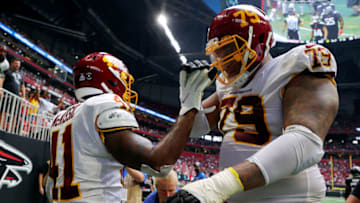 ATLANTA, GEORGIA - OCTOBER 03: J.D. McKissic #41 and Ereck Flowers #79 of the Washington Football Team celebrates a touchdown during the fourth quarter in the game against the Atlanta Falcons at Mercedes-Benz Stadium on October 03, 2021 in Atlanta, Georgia. (Photo by Kevin C. Cox/Getty Images)
