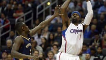 Dec 18, 2013; Los Angeles, CA, USA; Los Angeles Clippers small forward Stephen Jackson (1) looks to pass against New Orleans Pelicans shooting guard Anthony Morrow (3) during the second quarter at Staples Center. Mandatory Credit: Richard Mackson-USA TODAY Sports