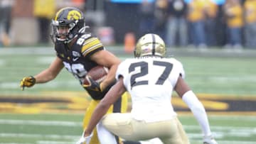 IOWA CITY, IOWA- OCTOBER 19: Wide receiver Nico Ragaini #89 of the Iowa Hawkeyes runs up the field during the first half in front of safety Navon Mosley #27 of the Purdue Boilermakers on October 19, 2019 at Kinnick Stadium in Iowa City, Iowa. (Photo by Matthew Holst/Getty Images)
