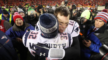 KANSAS CITY, MISSOURI - JANUARY 20: Tom Brady #12 of the New England Patriots celebrates with nn32#2 after defeating the Kansas City Chiefs in overtime during the AFC Championship Game at Arrowhead Stadium on January 20, 2019 in Kansas City, Missouri. The Patriots defeated the Chiefs 37-31. (Photo by Patrick Smith/Getty Images)