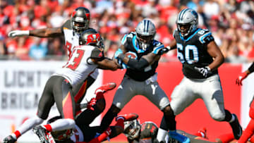 TAMPA, FL - OCTOBER 29: Carolina Panthers running back Fozzy Whittaker (43) tries to fight through the tackle by Tampa Bay Buccaneers safety T.J. Ward (43) during the first half of an NFL football game between the Carolina Panthers and the Tampa Bay Buccaneers on October 29, 2017, at Raymond James Stadium in Tampa, FL. (Photo by Roy K. Miller/Icon Sportswire via Getty Images)