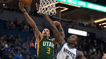 Jan 7, 2017; Minneapolis, MN, USA; Utah Jazz guard George Hill (3) shoots over Minnesota Timberwolves center Gorgui Dieng (5) during the fourth quarter at Target Center. Mandatory Credit: Brace Hemmelgarn-USA TODAY Sports