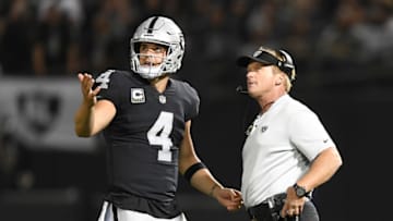 OAKLAND, CA - SEPTEMBER 10: Derek Carr #4 of the Oakland Raiders speaks with head coach Jon Gruden in the first quarter during their NFL game against the Los Angeles Rams at Oakland-Alameda County Coliseum on September 10, 2018 in Oakland, California. (Photo by Thearon W. Henderson/Getty Images)