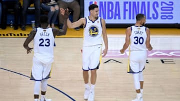 OAKLAND, CA - MAY 31: Draymond Green #23 of the Golden State Warriors celebrates with Klay Thompson #11 and Stephen Curry #30 against the Cleveland Cavaliers in Game 1 of the 2018 NBA Finals at ORACLE Arena on May 31, 2018 in Oakland, California. NOTE TO USER: User expressly acknowledges and agrees that, by downloading and or using this photograph, User is consenting to the terms and conditions of the Getty Images License Agreement. (Photo by Thearon W. Henderson/Getty Images)