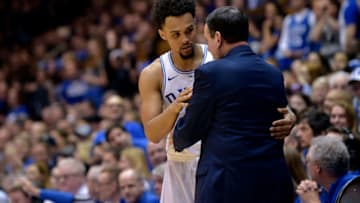 DURHAM, NC - FEBRUARY 14: Head coach Mike Krzyzewski hugs Gary Trent Jr.