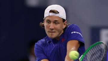 SHANGHAI, CHINA - OCTOBER 08: Lucas Pouille of France returns a shot to Daniil Medvedev of Russia during the First Round match on Day 1 of 2017 ATP 1000 Shanghai Rolex Masters on October 8, 2017 in Shanghai, China. (Photo by Kevin Lee/Getty Images)