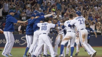 Jul 26, 2016; Toronto, Ontario, CAN; Toronto Blue Jays second baseman Devon Travis (29) celebrates the win following the twelfth inning against the San Diego Padres at Rogers Centre. The Toronto Blue Jays won 7-6. Mandatory Credit: Nick Turchiaro-USA TODAY Sports
