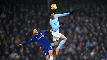 MANCHESTER, ENGLAND - MARCH 04: Danilo of Manchester City and Eden Hazard of Chelsea jump for the header during the Premier League match between Manchester City and Chelsea at Etihad Stadium on March 4, 2018 in Manchester, England. (Photo by Laurence Griffiths/Getty Images)
