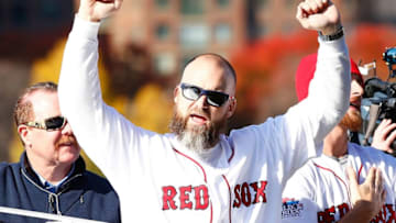 BOSTON, MA - NOVEMBER 02: David Ross #3 and Will Middlebrooks #16 of the Boston Red Sox celebrate on the Charles River during the World Series victory parade on November 2, 2013 in Boston, Massachusetts. (Photo by Jared Wickerham/Getty Images)