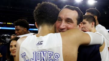 HOUSTON, TX - MARCH 29: Head coach Mike Krzyzewski hugs Tyus Jones