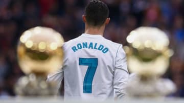 MADRID, SPAIN - DECEMBER 09: Cristiano Ronaldo of Real Madrid CF walks to the pitch after posing with his five Golden Ball (Ballon d'Or) trophies prior to start the La Liga match between Real Madrid CF and Sevilla FC at Estadio Santiago Bernabeu on December 9, 2017 in Madrid, Spain . (Photo by Gonzalo Arroyo Moreno/Getty Images)