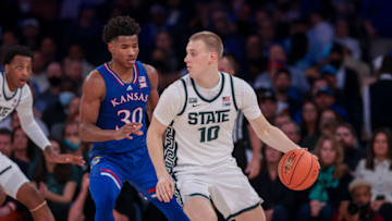 Nov 9, 2021; New York, New York, USA; Michigan State Spartans forward Joey Hauser (10) dribbles as Kansas Jayhawks guard Ochai Agbaji (30) defends during the second half at Madison Square Garden. Mandatory Credit: Vincent Carchietta-USA TODAY Sports