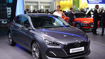 FRANKFURT AM MAIN, GERMANY - SEPTEMBER 12: Visitors look at the new Hyundai i30 Fastback passenger car at the 2017 Frankfurt Auto Show on September 12, 2017 in Frankfurt am Main, Germany. The Frankfurt Auto Show is taking place during a turbulent period for the auto industry. Leading companies have been rocked by the self-inflicted diesel emissions scandal. At the same time the industry is on the verge of a new era as automakers commit themselves more and more to a future that will one day be dominated by electric cars. (Photo by Sean Gallup/Getty Images)