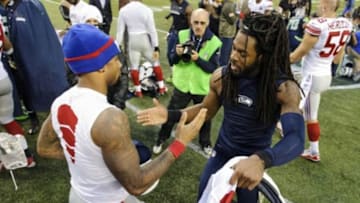 Nov 9, 2014; Seattle, WA, USA; New York Giants wide receiver Odell Beckham (13) and Seattle Seahawks cornerback Richard Sherman (25) exchange jerseys after the game at CenturyLink Field. Mandatory Credit: Steven Bisig-USA TODAY Sports
