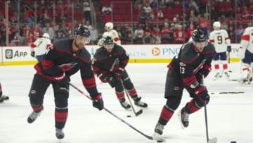 Dec 30, 2022; Raleigh, North Carolina, USA; Carolina Hurricanes defenseman Calvin de Haan (44), right wing Stefan Noesen (23) and defenseman Jalen Chatfield (5) skate before the game during warmups against the Florida Panthers at PNC Arena. Mandatory Credit: James Guillory-USA TODAY Sports