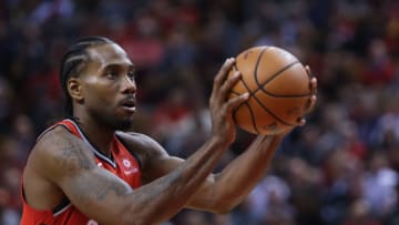 TORONTO, ON - OCTOBER 17: Kawhi Leonard #2 of the Toronto Raptors shoots a free throw during the second half of the NBA season opener against the Cleveland Cavaliers at Scotiabank Arena on October 17, 2018 in Toronto, Canada. NOTE TO USER: User expressly acknowledges and agrees that, by downloading and or using this photograph, User is consenting to the terms and conditions of the Getty Images License Agreement. (Photo by Vaughn Ridley/Getty Images)