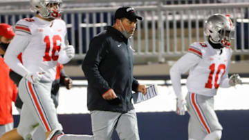 Before returning to the field for the final play of the second quarter, Ohio State Buckeyes head coach Ryan Day jogs to the locker room after he and the team believed the clock had expired during the NCAA football game against Penn State at Beaver Stadium in University Park, Pa. on Saturday, Oct. 31, 2020.Ohio State Faces Penn State In Happy Valley