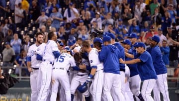 Sep 27, 2016; Kansas City, MO, USA; Kansas City Royals center fielder Billy Burns (14) is congratulated after driving in the winning run with a sacrifice fly against the Minnesota Twins in the eleventh inning at Kauffman Stadium. Kansas City won 4-3 in 11 innings. Mandatory Credit: John Rieger-USA TODAY Sports