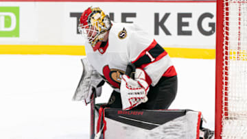VANCOUVER, BC - JANUARY 27: Goalie Marcus Hogberg #1 of the Ottawa Senators makes a save during NHL hockey action against the Vancouver Canucks at Rogers Arena on January 27, 2021 in Vancouver, Canada. (Photo by Rich Lam/Getty Images)