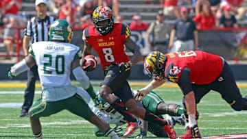 Sep 19, 2015; College Park, MD, USA; Maryland Terrapins wide receiver Levern Jacobs (8) runs for a gain before being tackled by South Florida Bulls safety Devin Abraham (20) at Byrd Stadium. Mandatory Credit: Mitch Stringer-USA TODAY Sports