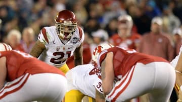 Dec 30, 2015; San Diego, CA, USA; USC Trojans linebacker Su'a Cravens (21) looks across the line before the snap against the Wisconsin Badgers during the second quarter in the 2015 Holiday Bowl at Qualcomm Stadium. Mandatory Credit: Jake Roth-USA TODAY Sports
