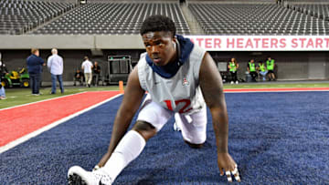 TUCSON, ARIZONA - OCTOBER 12: JB Brown #12 of the Arizona Wildcats warms up before the game against the Washington Huskies at Arizona Stadium on October 12, 2019 in Tucson, Arizona. (Photo by Alika Jenner/Getty Images)