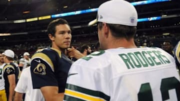 Aug 17, 2013; St. Louis, MO, USA; St. Louis Rams quarterback Sam Bradford (8) talks with Green Bay Packers quarterback Aaron Rodgers (12) after a game at the Edward Jones Dome. Mandatory Credit: Jeff Curry-USA TODAY Sports