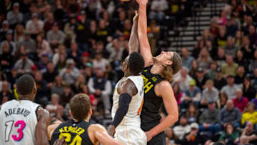 Utah Jazz forward-center Kelly Olynyk (41) and Miami Heat guard Victor Oladipo (4) reach for a jump ball( Christopher Creveling-USA TODAY Sports)