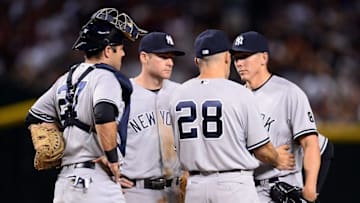 May 16, 2016; Phoenix, AZ, USA; New York Yankees manager Joe Girardi (28) pulls New York Yankees starting pitcher Chad Green (38) out of the game during the fifth inning against the Arizona Diamondbacks at Chase Field. Mandatory Credit: Joe Camporeale-USA TODAY Sports