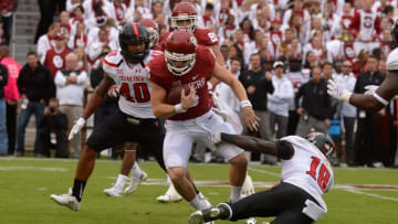 Oct 24, 2015; Norman, OK, USA; Oklahoma Sooners quarterback Baker Mayfield (6) runs through a tackle attempt by Texas Tech Red Raiders linebacker Micah Awe (18) during the second quarter at Gaylord Family - Oklahoma Memorial Stadium. Mandatory Credit: Mark D. Smith-USA TODAY Sports