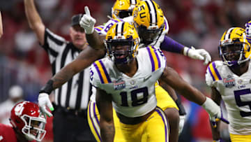 ATLANTA, GEORGIA - DECEMBER 28: Linebacker K'Lavon Chaisson #18 of the LSU Tigers and teammates celebrate a defensive stop against the Oklahoma Sooners during the Chick-fil-A Peach Bowl at Mercedes-Benz Stadium on December 28, 2019 in Atlanta, Georgia. (Photo by Gregory Shamus/Getty Images)