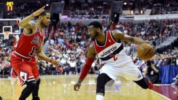 Apr 27, 2014; Washington, DC, USA; Washington Wizards point guard John Wall (2) dribbles as Chicago Bulls small forward Ronnie Brewer (11) defends during the first quarter in game four of the first round of the 2014 NBA Playoffs at Verizon Center. Mandatory Credit: Brad Mills-USA TODAY Sports