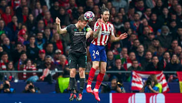 MADRID, SPAIN - FEBRUARY 18: Sime Vrsaljko of Atletico de Madrid competes for the ball with James Milner of Liverpool FC during the UEFA Champions League round of 16 first leg match between Atletico Madrid and Liverpool FC at Wanda Metropolitano on February 18, 2020 in Madrid, Spain. (Photo by Mateo Villalba/Quality Sport Images/Getty Images)