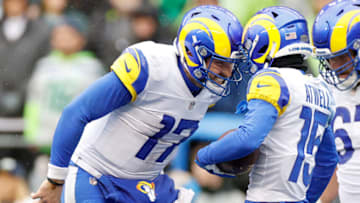 SEATTLE, WASHINGTON - JANUARY 08: Baker Mayfield #17 and Tutu Atwell #15 of the Los Angeles Rams celebrate a touchdown during the second quarter against the Seattle Seahawks at Lumen Field on January 08, 2023 in Seattle, Washington. (Photo by Steph Chambers/Getty Images)