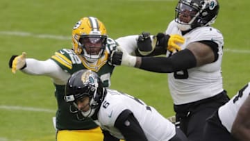 Green Bay Packers linebacker Rashan Gary (52) gets past Jacksonville Jaguars offensive tackle Jawaan Taylor (75) to sack quarterback Jake Luton (6) late in the fourth quarter Sunday, November 15, 2020, at Lambeau Field in Green Bay, Wis.Apc Packvsjaguars 1113201221
