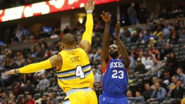 Mar 25, 2015; Denver, CO, USA; Philadelphia 76ers guard Jason Richardson (23) shoots the ball over Denver Nuggets guard Randy Foye (4) during the second half at Pepsi Center. The 76ers won 99-85. Mandatory Credit: Chris Humphreys-USA TODAY Sports