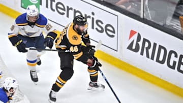 BOSTON, MA - JUNE 12: Boston Bruins center David Krejci (46) tries to keep the puck away from St. Louis Blues defenseman Vince Dunn (29) behind the Blues net. During Game 7 of the Stanley Cup Finals featuring the Boston Bruins against the St. Louis Blues on June 12, 2019 at TD Garden in Boston, MA. (Photo by Michael Tureski/Icon Sportswire via Getty Images)