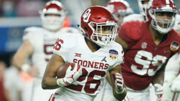 MIAMI, FL - DECEMBER 29: Kennedy Brooks #26 of the Oklahoma Sooners runs with the ball against the Alabama Crimson Tide during the College Football Playoff Semifinal at the Capital One Orange Bowl at Hard Rock Stadium on December 29, 2018 in Miami, Florida. (Photo by Michael Reaves/Getty Images)