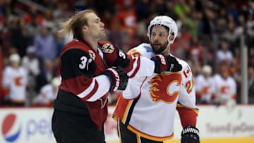 Mar 28, 2016; Glendale, AZ, USA; Arizona Coyotes left wing Jiri Sekac (36) and Calgary Flames defenseman Deryk Engelland (29) fight during the third period at Gila River Arena. Mandatory Credit: Joe Camporeale-USA TODAY Sports