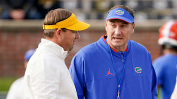 Nov 20, 2021; Columbia, Missouri, USA; Missouri Tigers head coach Eli Drinkwitz talks with Florida Gators head coach Dan Mullen on field before the game at Faurot Field at Memorial Stadium. Mandatory Credit: Denny Medley-USA TODAY Sports